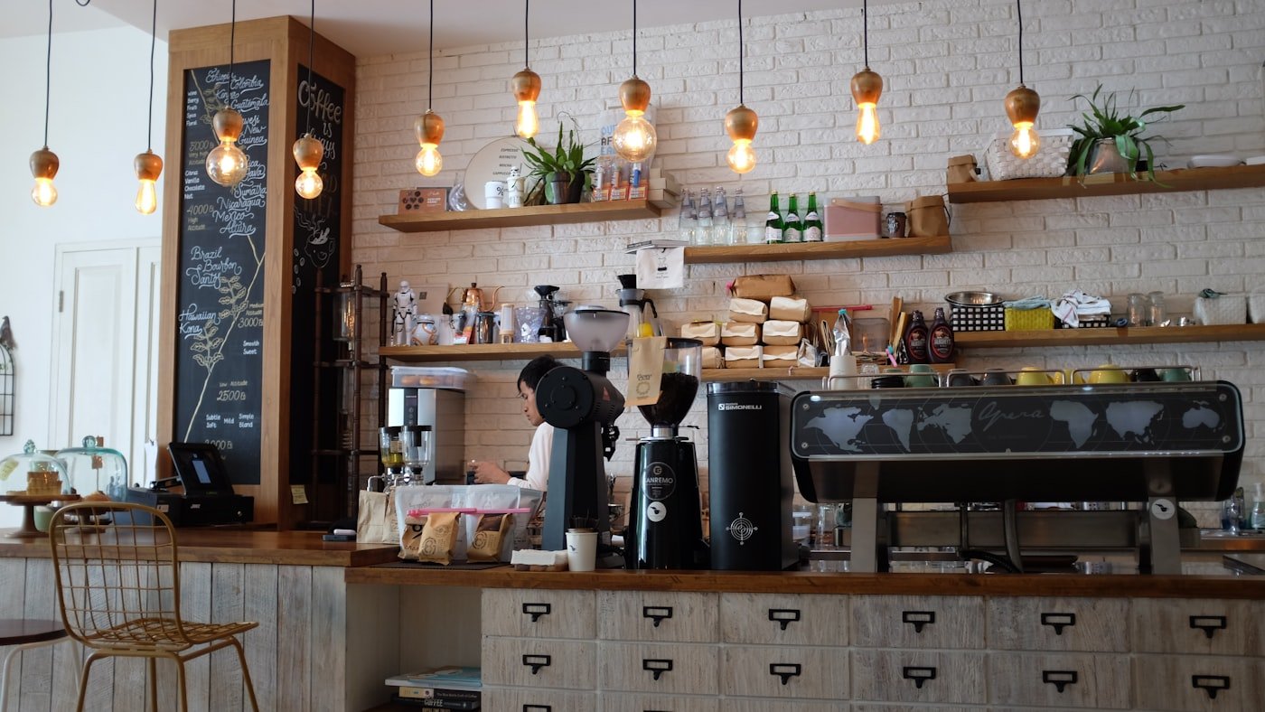Customers ordering on phones at a café table